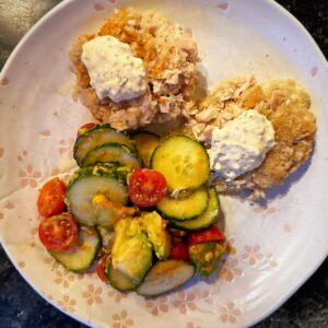 Those are tuna cakes on a plate.